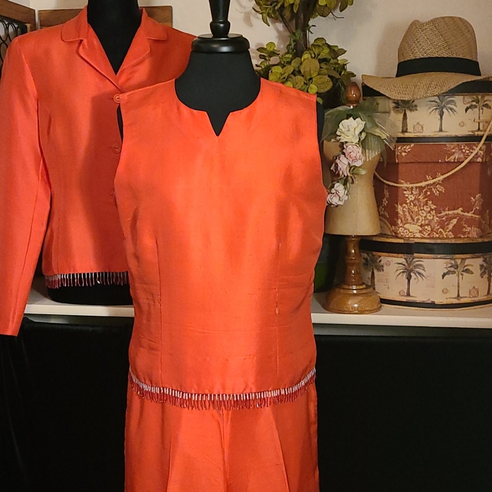 S.L.B suit. Jkt/top size 12 pants size 10